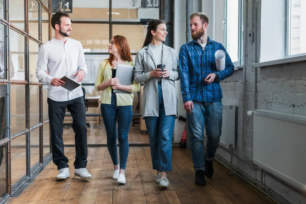 a group of people walking in a room to discuss exit planning