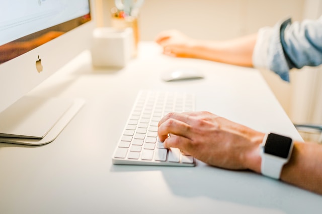 a person typing on a keyboard