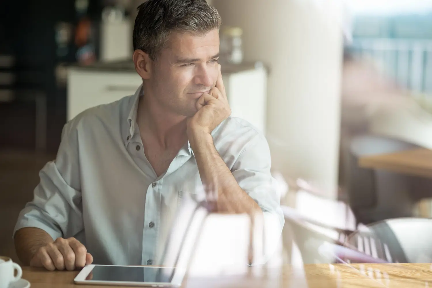 middle aged business owner contemplating issues