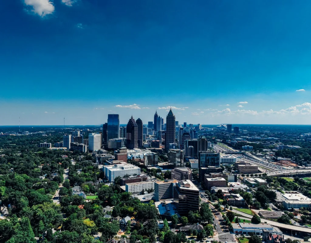 Aerial view of the Atlanta skyline under a clear blue sky