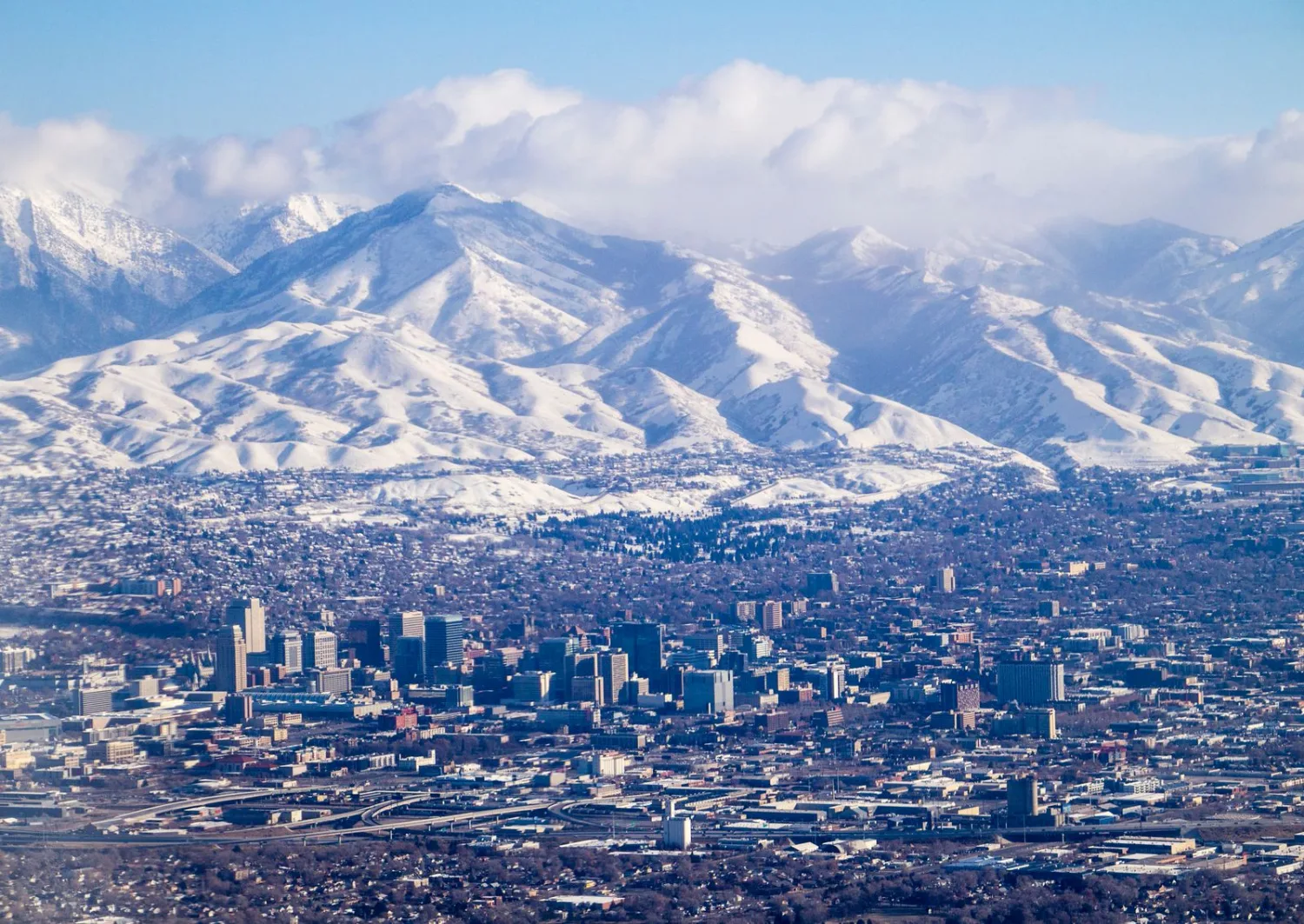 Salt Lake City skyline with the snow-capped Wasatch Range behind it